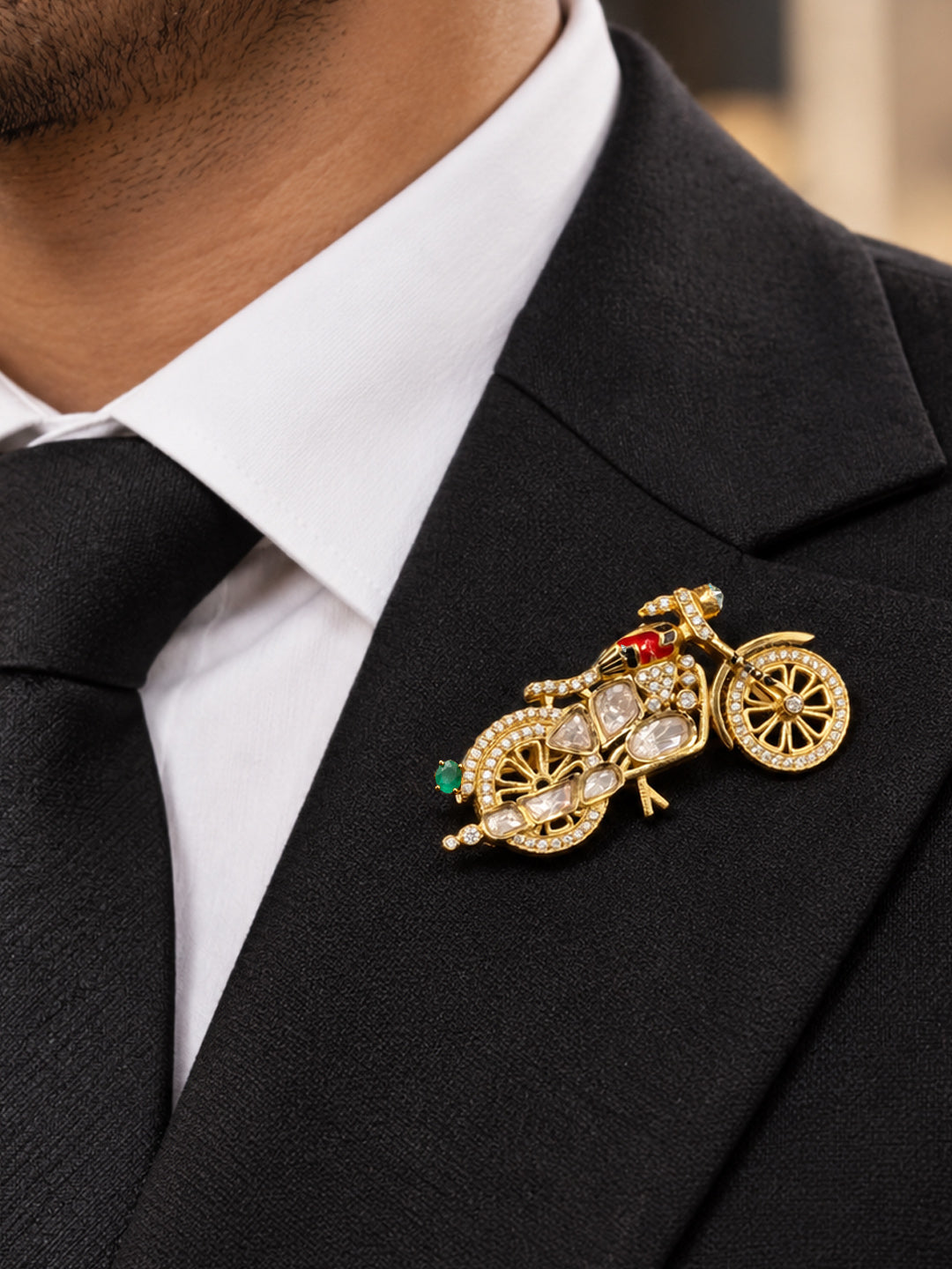 Aurveza quirky motorcycle brooch with green emerald stone and sparkling gold finish