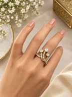 Close-up of Aurveza statement ring featuring three sparkling stones on pave gold band
