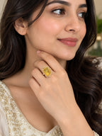 Close-up of Aurveza statement ring with yellow citrine stone and ornate gold band